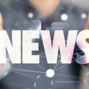 Hands embracing the word "News"